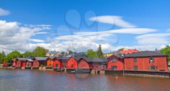 Old red wooden houses on the river coast, historical part of Porvoo, Finland