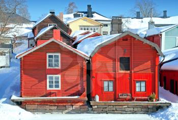 Red wooden houses on the river coast in Porvoo town, Finland 