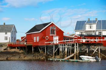 Traditional Norwegian coastal village. Wooden houses on rocky coast