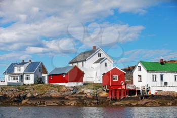 Traditional Norwegian coastal fishing village with red and white wooden houses