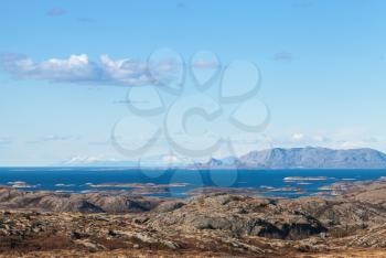 Empty Norwegian coastal landscape with sea, sky and mountains
