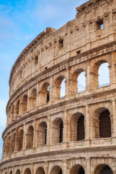 Exterior of the Colosseum or Coliseum, also known as the Flavian Amphitheatre, vertical photo