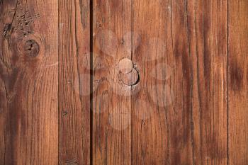 Vintage brown weathered wooden wall with knots, background photo texture