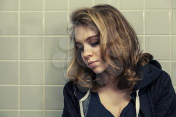Caucasian blond teenage girl, artistic portrait. Tonal filter correction, vintage stylized photo with old style effect