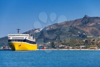 Yellow passenger ferry moored in port of Zakynthos, Greek island in the Ionian Sea, popular tourist destination for summer holidays