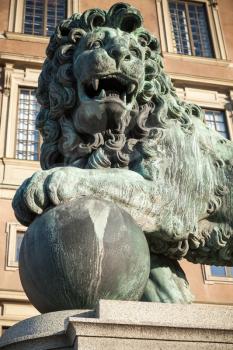 Bronze statue of the lion at Royal Palace. Old Town of Stockholm, Sweden. Close-up photo