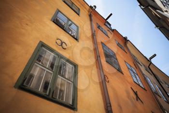 Old yellow living house facade. Gamla stan, the old town in central Stockholm, Sweden