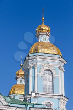 Orthodox St. Nicholas Naval Cathedral, facade fragment with golden domes, St. Petersburg, Russia