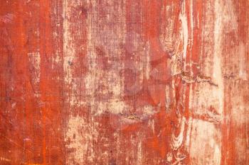 Old red grungy plywood sheet, background photo texture