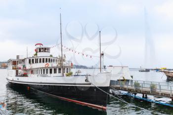 Vintage ship stands moored near La Rade lake coast in Geneve, Switzerland