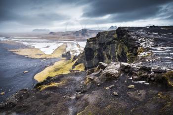 Scenic Icelandic coastal landscape. North Atlantic Ocean coast, black sand beach, Vik district, Iceland