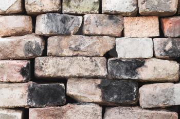 Wall made of old used bricks without concrete, background photo texture