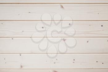 New wooden wall made of varnished pine tree planks. Frontal flat background photo texture
