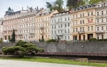 Old living houses facades along Tepla river coast. Karlovy Vary town, Czech Republic