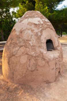 Round clay oven. Ancient fortress in Catalonia, Spain, Iberian Citadel of Calafell