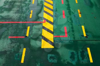 Green ferry deck with colorful marking, transportation background