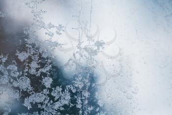 Frost on window glass abstract background macro photo texture