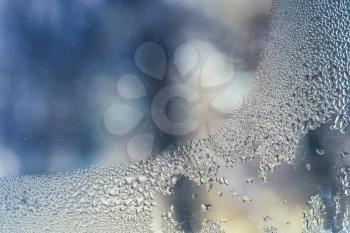 Water condensation on window glass, closeup abstract background photo
