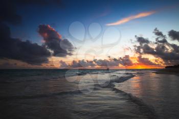 Colorful dark seascape in a sunrise. Atlantic Ocean coast, Bavaro beach, Hispaniola Island. Dominican Republic