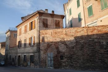 Street view of old Italian town in evening sun light, Fermo, Italy