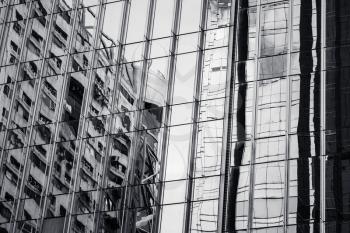 Modern architecture abstract black and white fragment, walls made of glass and steel with reflections