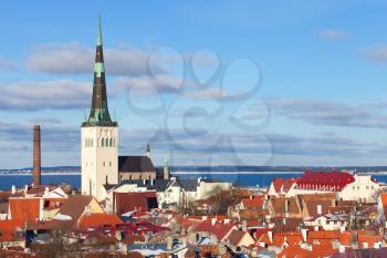 Old Tallinn cityscape panorama. Houses with red roofs and church St. Olaf