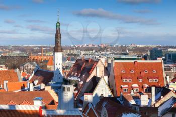 Cityscape panorama of Old Tallinn, Estonia. Houses with red roofs and Holy Spirit Church tower