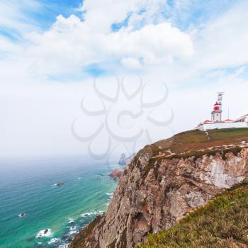 Landscape of Cabo da Roca with the lighthouse on the rock, it is a popular tourist attraction and limit of continental Europe