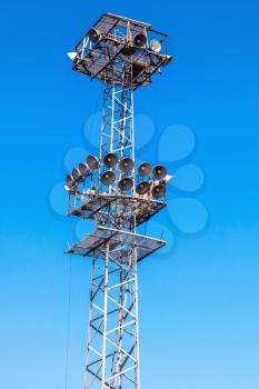 Industrial illumination tower with lamps under blue sky in port of Burgas, Bulgaria