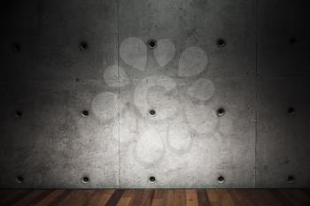 Dark concrete wall and wooden parquet. Contemporary empty interior background photo