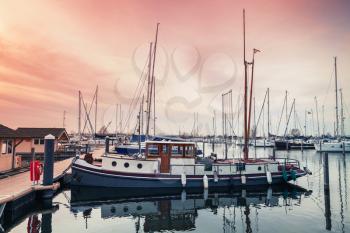 Old pleasure boat and Sailing yachts moored in Muiderzand marina, Amsterdam, Netherlands