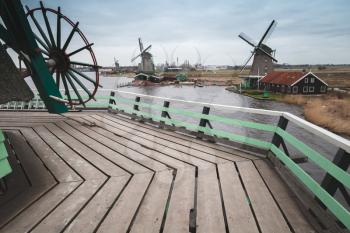 Windmills on coast of Zaan river, Zaanse Schans historic village, Netherlands