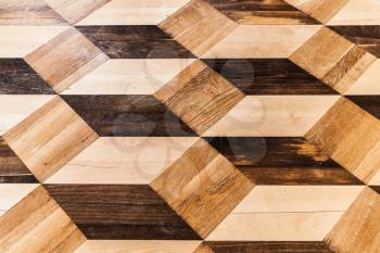 Classic wooden parquet, volume cubes illusion. Flooring background photo texture