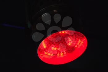 Red spot light, LED stage illumination equipment. Close up photo