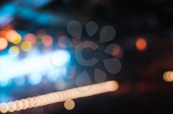 Blurred lights background with music concert hall, colorful illumination and bokeh effect