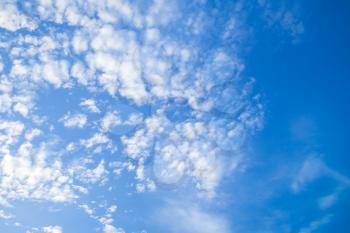 Altocumulus, white clouds in blue sky, natural background photo
