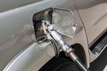 LPG filling of modern SUV car on a gas station