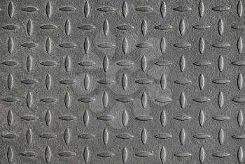 Gray diamond plate metal wall pattern. Background texture, frontal view