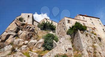 Stone living houses on big rock. Old Corsican town landscape, Sartene, South Corsica island, France