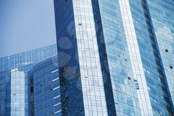 Abstract modern architecture background, office towers made of blue glass and steel