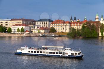 Passenger ship goes on Vltava river, Prague at summer day. Czech Republic