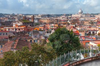 Cityscape of Rome, Italy. The Papal Basilica of St. Peter in the Vatican on the horizon, photo taken from the Pincian Hill