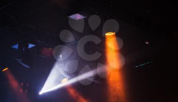Spot lights beams in scenic smoke, stage illumination background photo