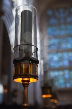 Candle lamp in Catholic Church. Bath Abbey, Somerset, UK