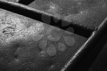 Old black steel surface. Close-up background photo