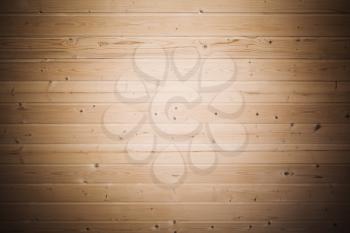 Background texture of wooden wall made of pine tree planks with spot light illumination