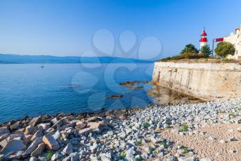 Coastal landscape of Ajaccio, citadel with lighthouse tower, Corsica island, France