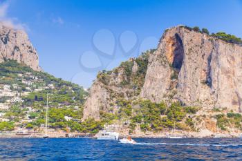 Landscape with coastal rocks of Capri island. Marina Piccola beach. Mediterranean Sea, Italy