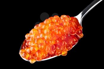 Red caviar in metal teaspoon isolated on black background