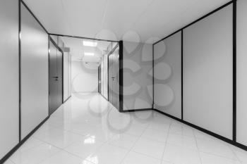 Abstract empty office interior with white walls and black decor